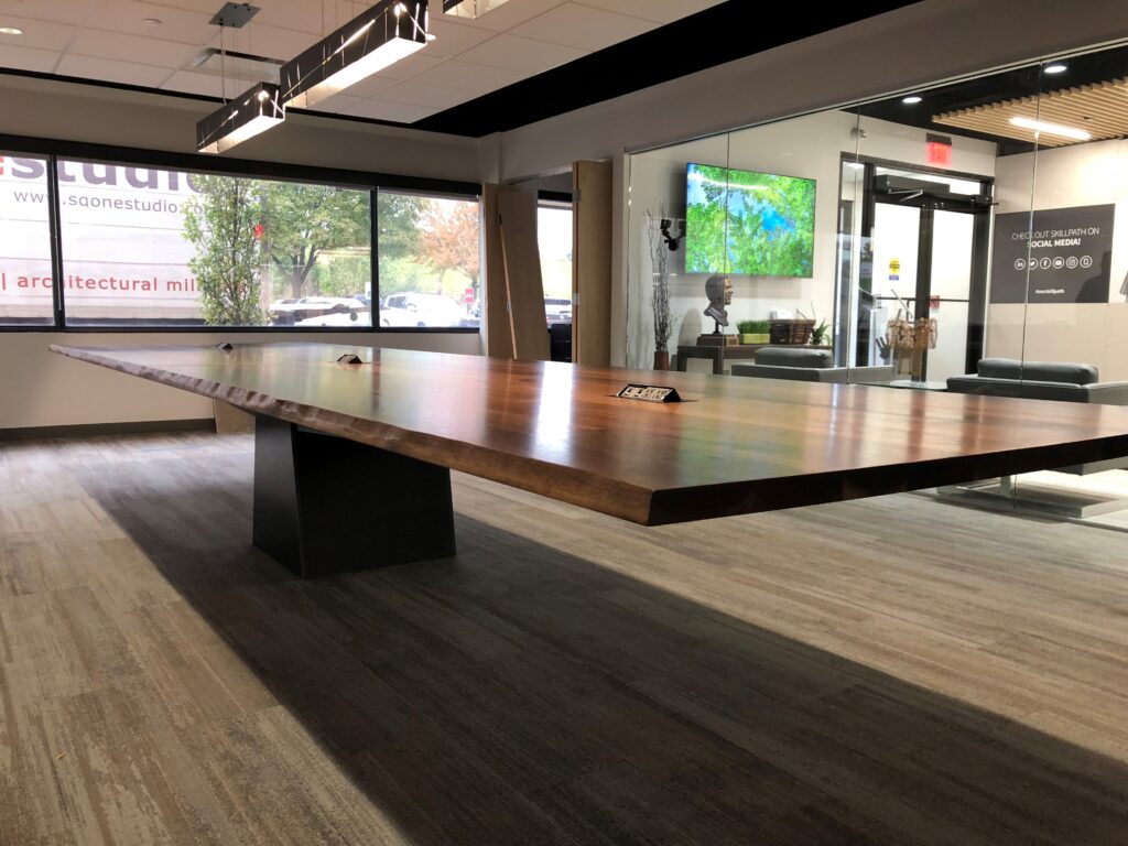 Cantilevered walnut conference table